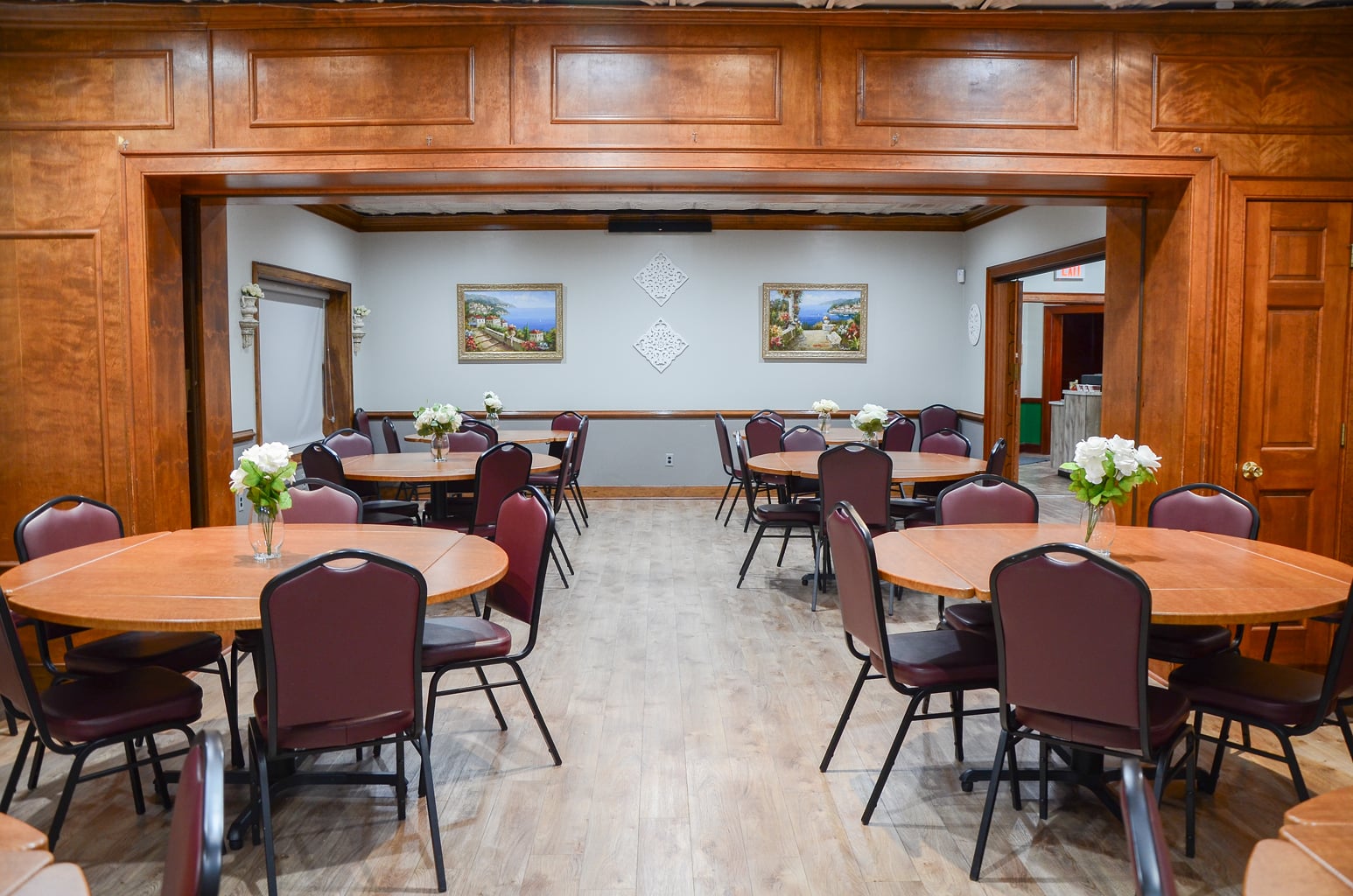 Private Room 2 at Ledo Pizza Lynchburg with group dining tables, chairs, and floral centerpieces