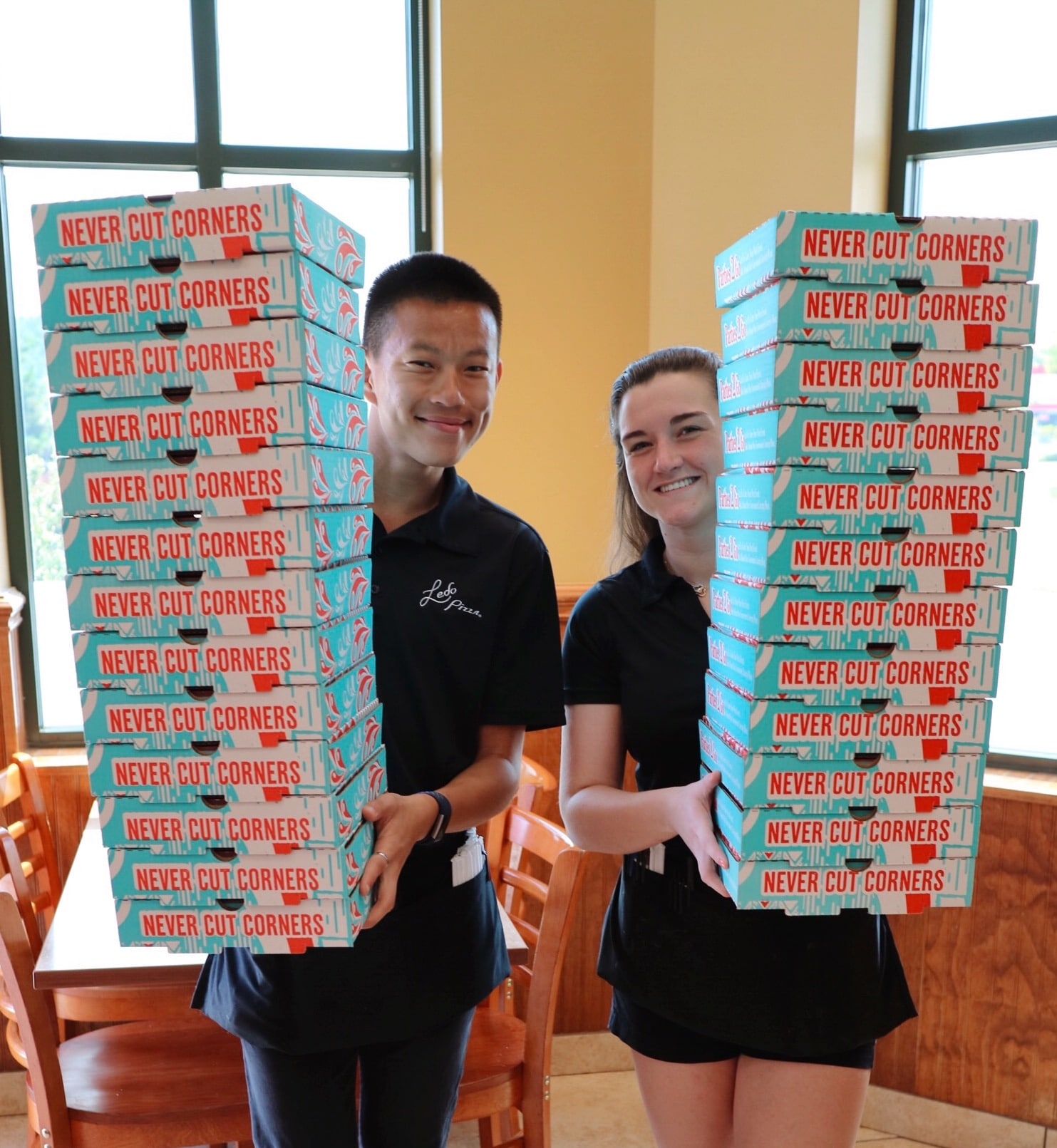 Ledo Pizza Staff Holding Boxes