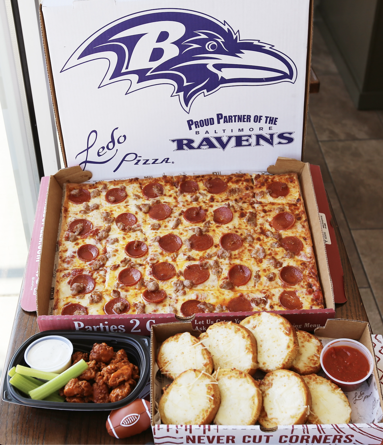 Proud Partner of the Baltimore Ravens with food