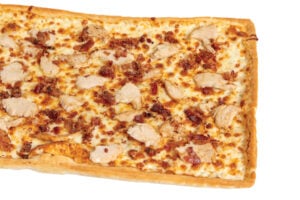 Turkey Delight Pizza with thick-cut roasted turkey slices, ranch sauce, smoked provolone cheese, and pre-cooked bacon.