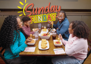 Mother, father, daughter, and son enjoy all you can eat pasta at ledo pizza with Sunday Funday text on image