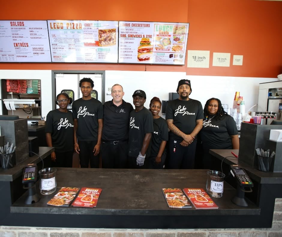 Photo of Ledo Pizza South Lake smiling and wear black uniforms.