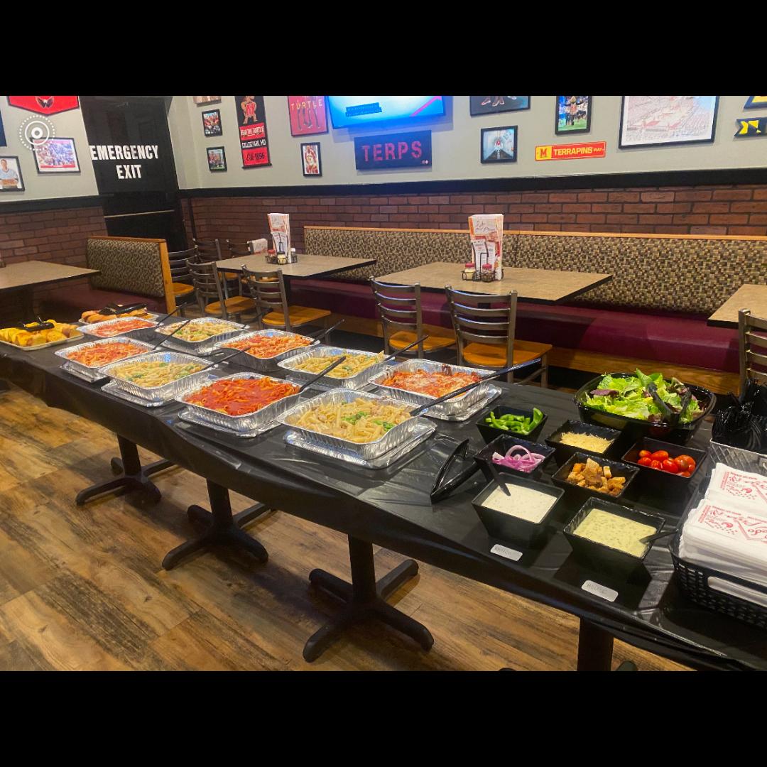 Food for Your Gathering Buffet of party food arranged along tables at Ledo Pizza Crofton